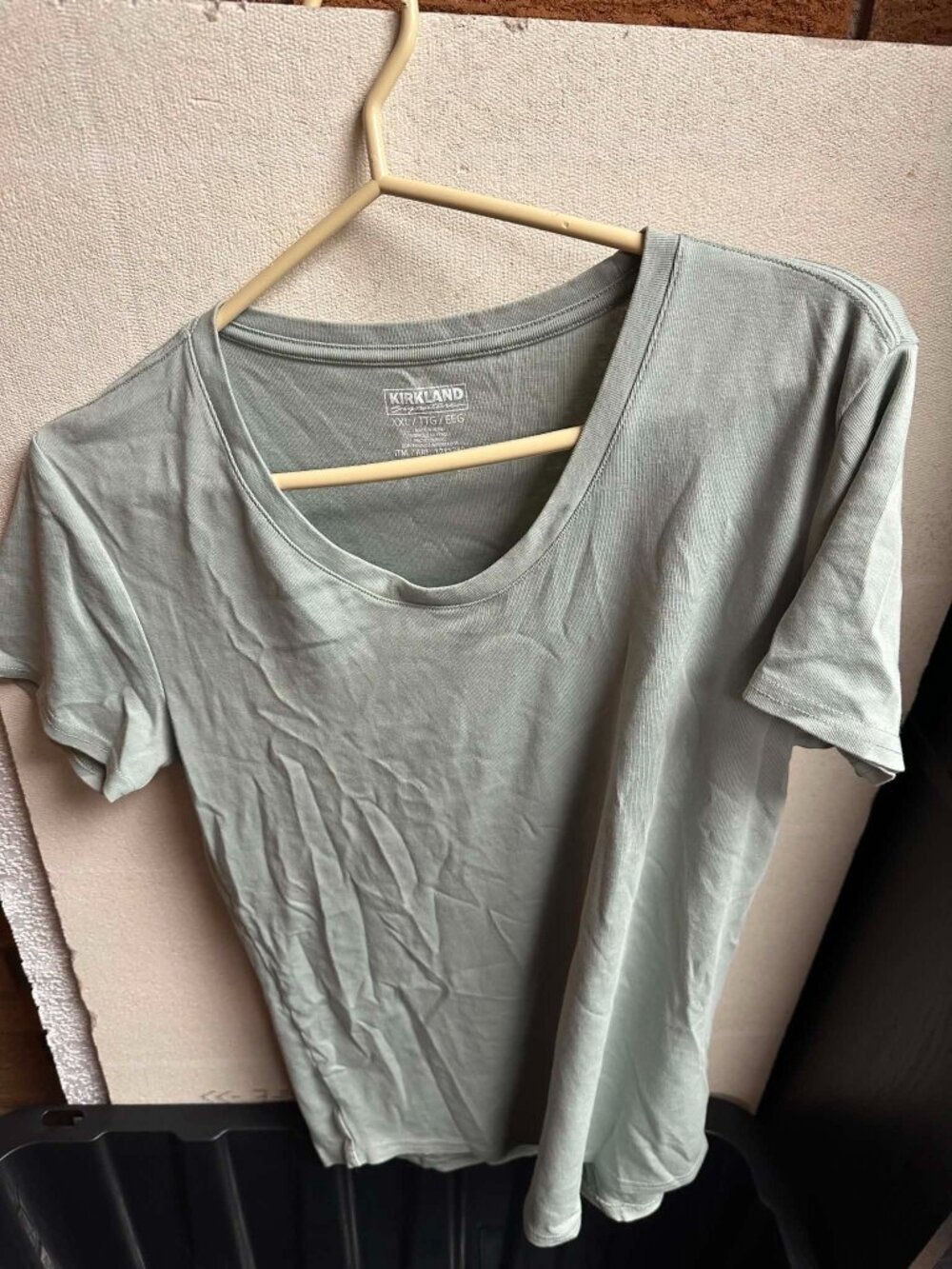 Ladies green Kirkland t-shirt.